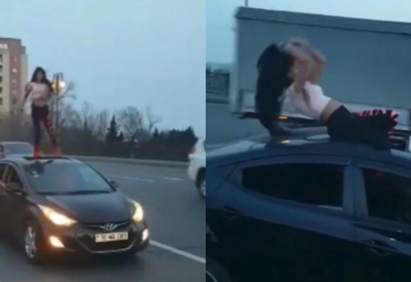 В центре Баку девушка вызвала всеобщее удивление горячим танцем на автомобиле