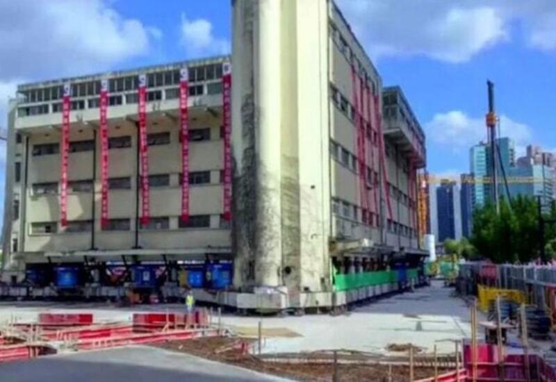 Çində 7 600 tonluq nəhəng binanı "yeritdilər"