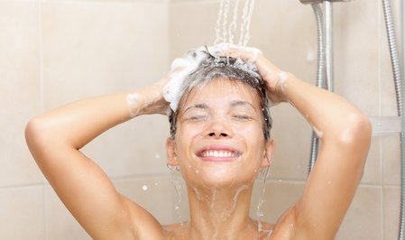woman in shower washing hair